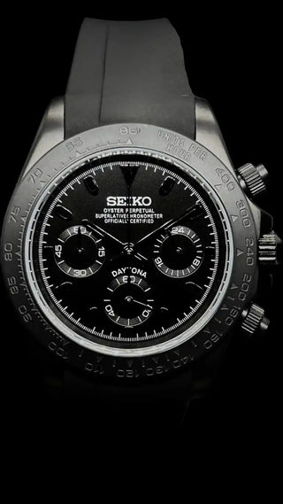 Seiko chronograph watch with a black dial and rubber strap.