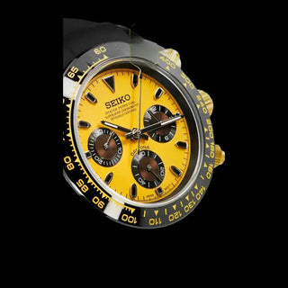 Yellow-faced Seiko chronograph watch with black bezel and gold accents.